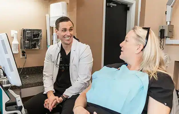 Dental patient is having a conversation with the dentist at Darley Dental Care
