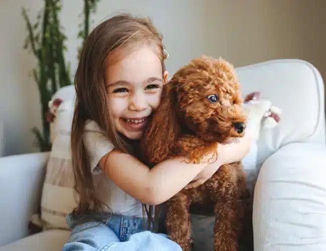 Girl with her dog at Pediatric Dentistry visit at Darley Dental Care